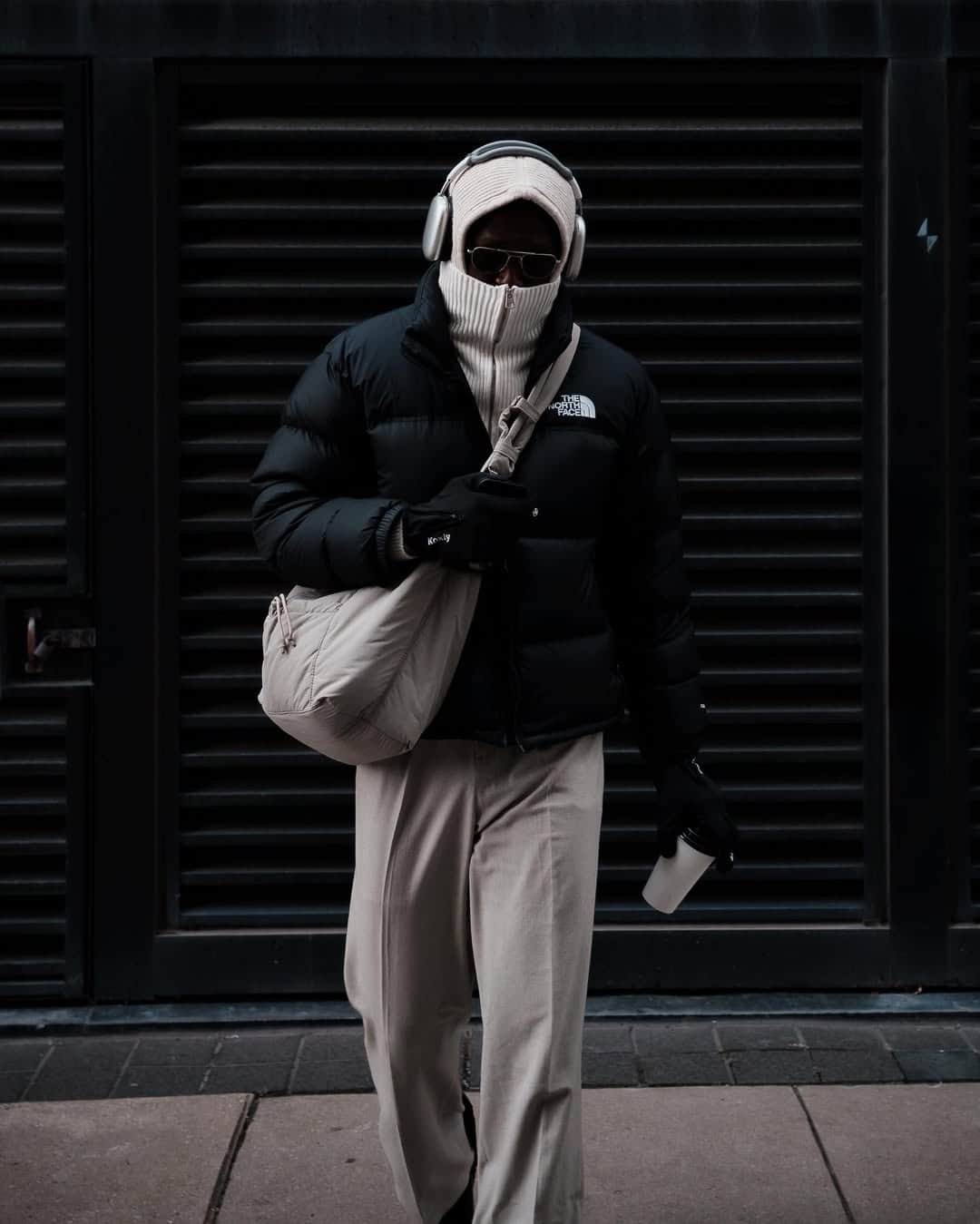 Winter streetwear, black coat and scarf