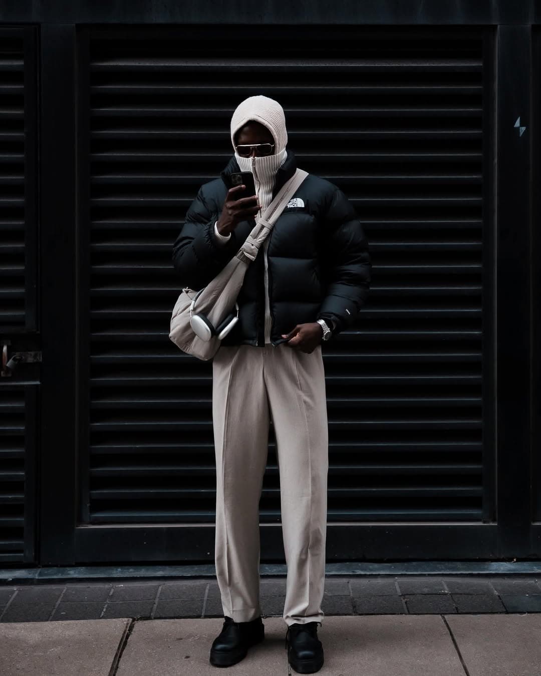 Winter streetwear, black coat and scarf